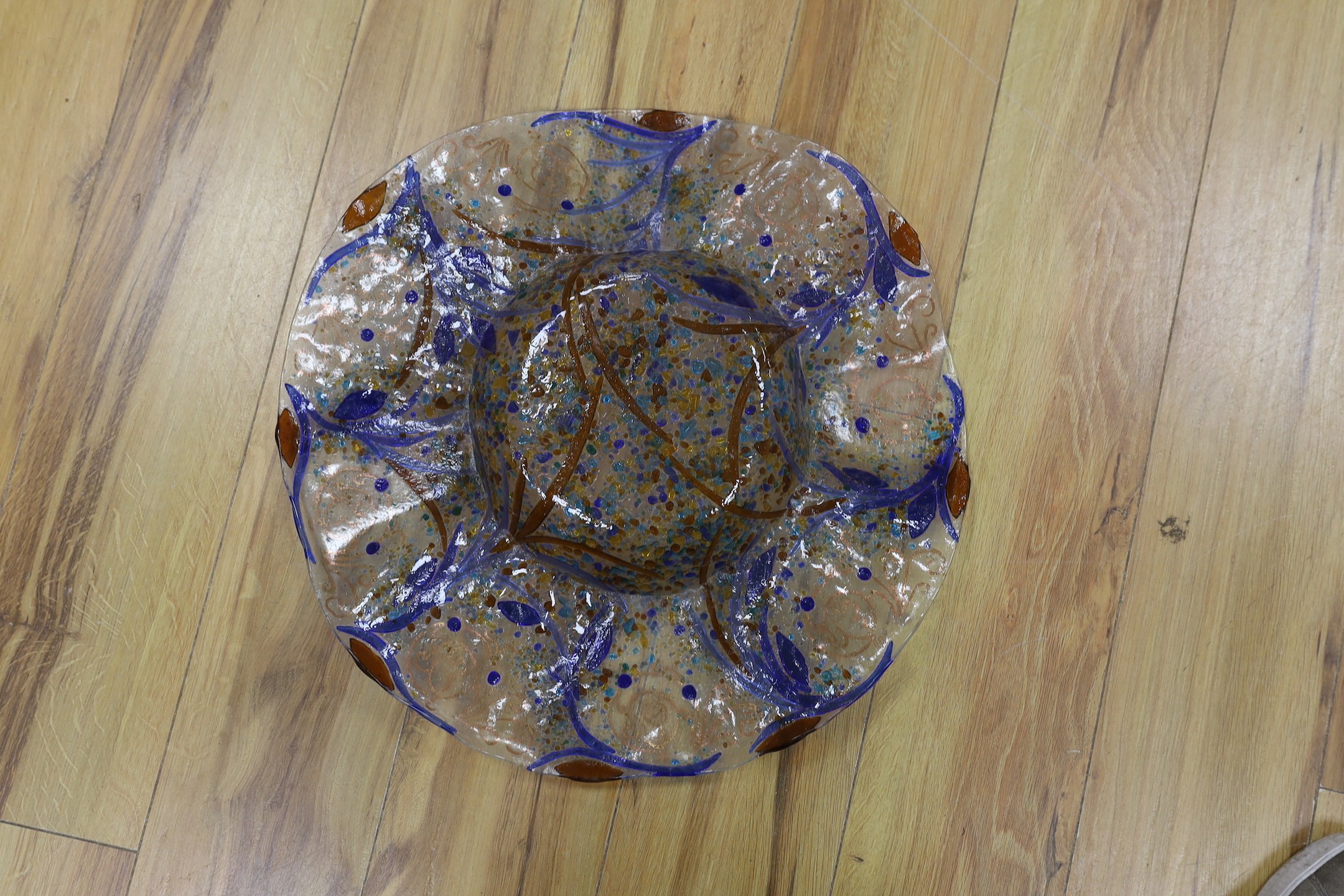 A circular decorative art glass dish, 48cms wide